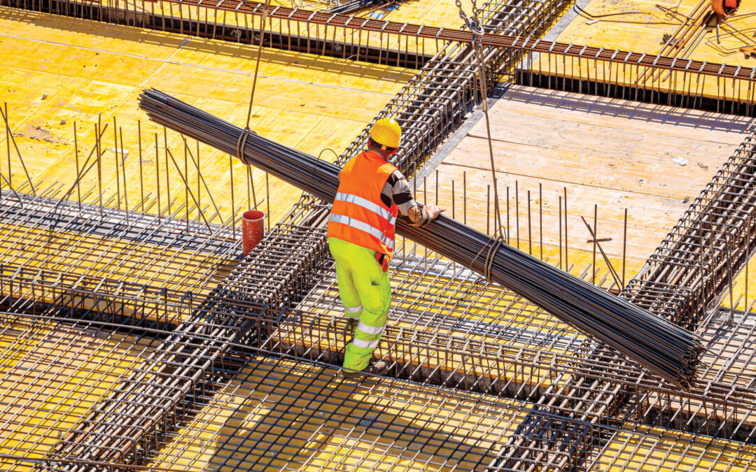 Structural steel delivery at a commercial construction site